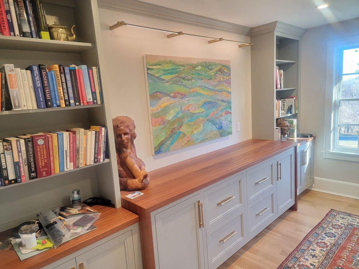 Elegant built-in cabinetry and book storage in a bright and modern office space in Acton, MA