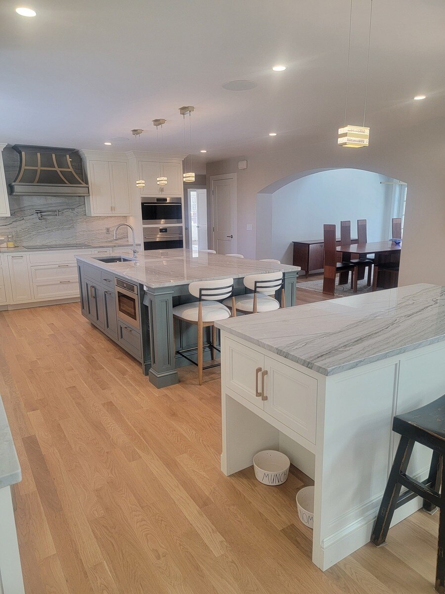 Kitchen renovation project in Acton, MA, incorporating custom-built cabinetry and elegant lighting by Thomas Buckborough & Associates