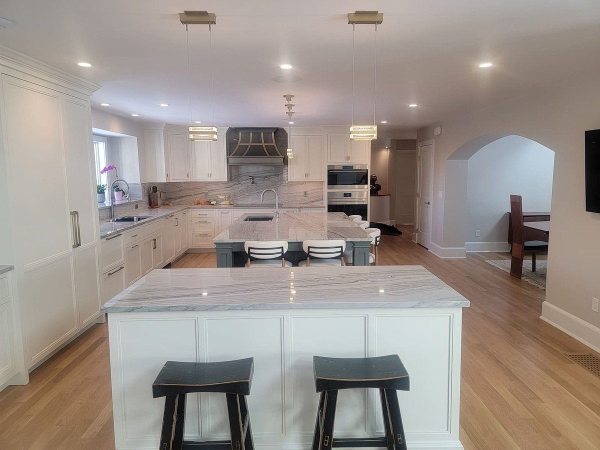 Spacious and well-lit kitchen designed by Thomas Buckborough & Associates, with a large island and premium finishes in Acton, MA