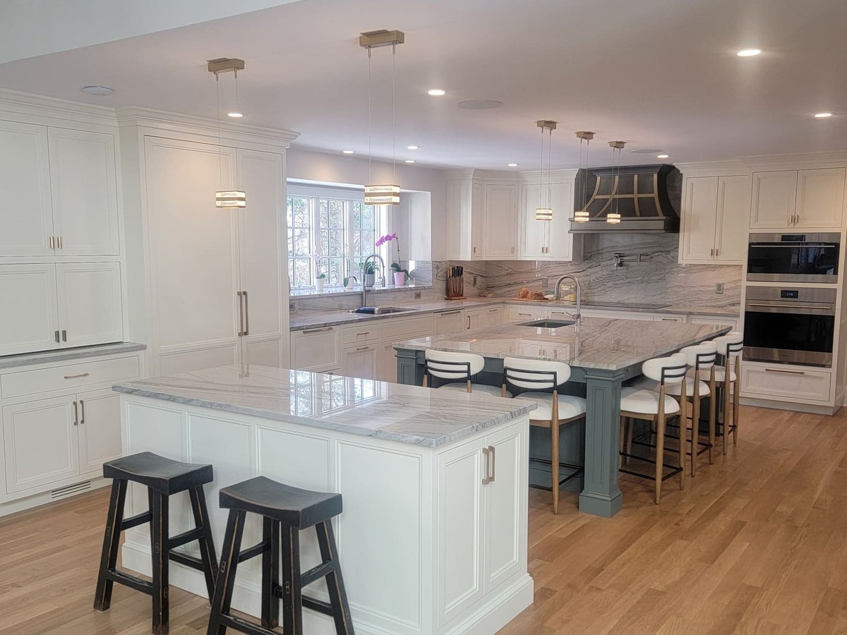 Stunning kitchen renovation in Acton, MA, by Thomas Buckborough & Associates, designed with shaker cabinets and elegant marble countertops