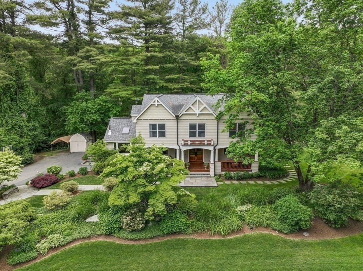 Acton, MA home renovation aerial view highlighting extensive greenery and updated exterior by Thomas Buckborough & Associates