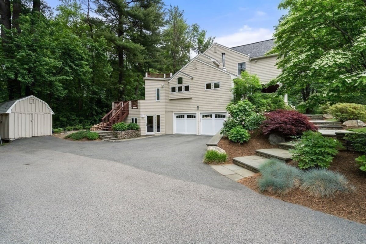 Acton, MA remodeled home featuring spacious driveway and landscape design by Thomas Buckborough & Associates