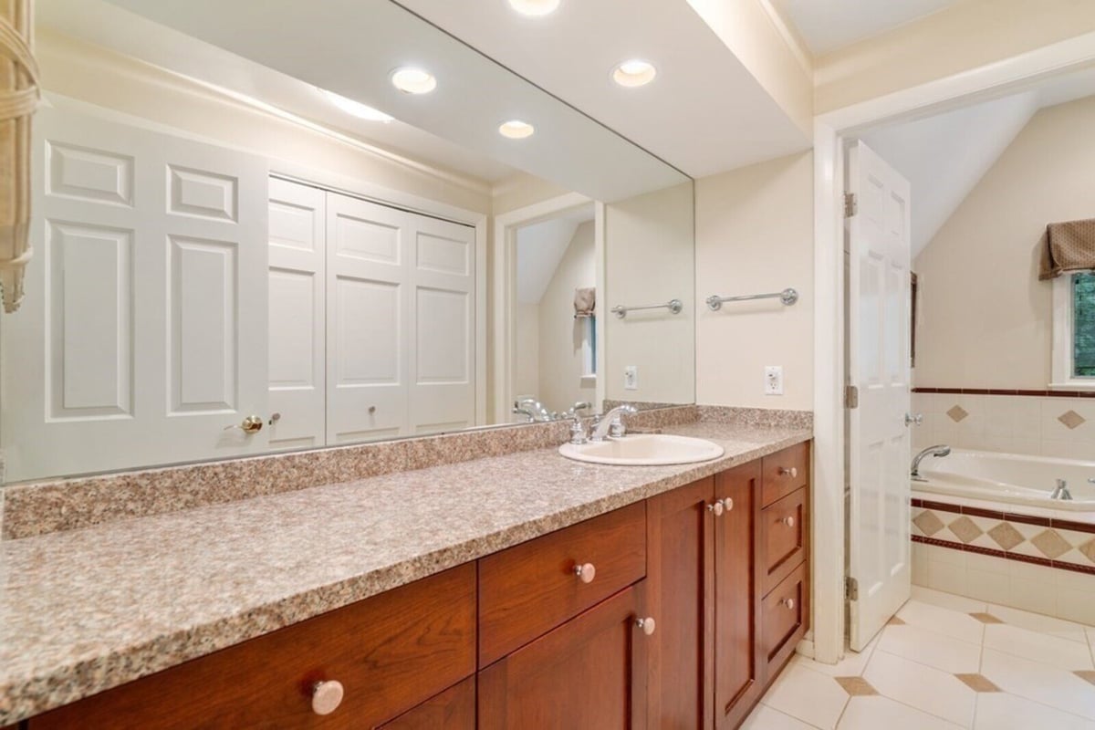 Bathroom vanity with granite countertop in home remodeled by Thomas Buckborough & Associates, Acton MA