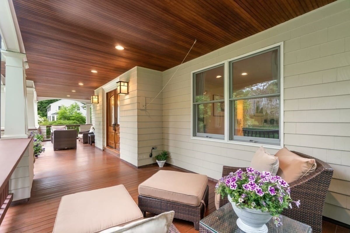 Beautifully remodeled covered porch with recessed lighting in Acton, MA, by Thomas Buckborough & Associates