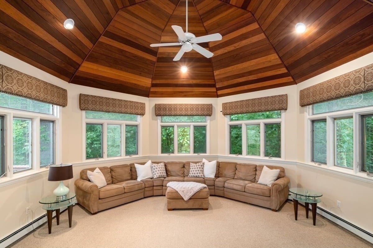 Cozy sunroom remodel with vaulted wood ceiling by Thomas Buckborough & Associates in Acton, MA