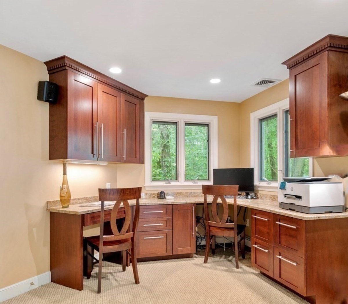 Home office remodel in Acton featuring built-in cherry cabinets and corner desk by Thomas Buckborough & Associates
