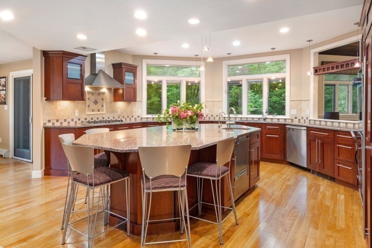 Interior view of an open-concept kitchen remodel in Acton, MA by Thomas Buckborough & Associates