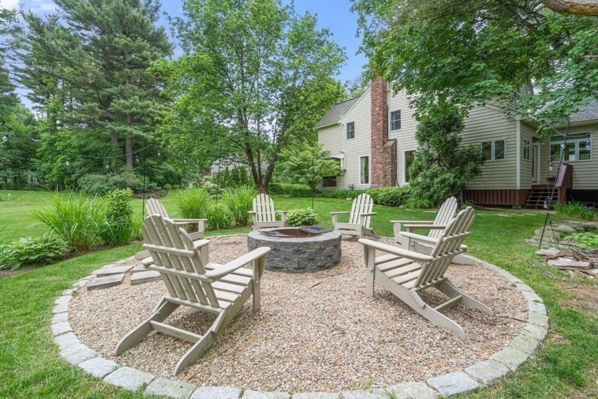 Relaxing backyard firepit in Acton, MA, designed as part of a home remodel by Thomas Buckborough & Associates