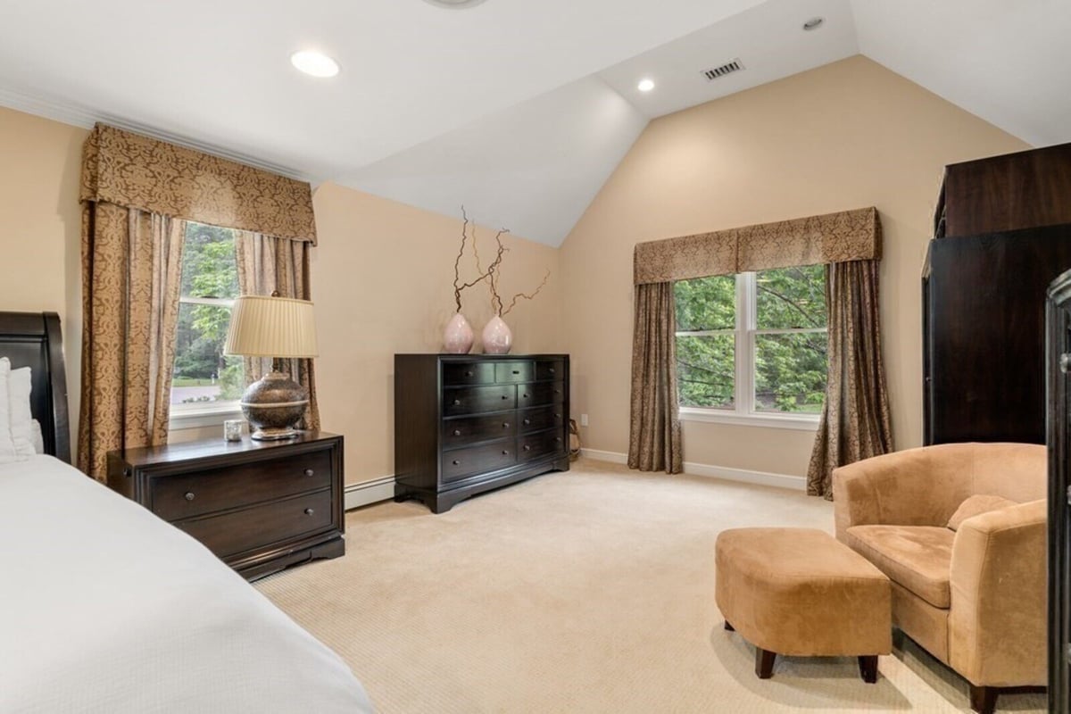 Spacious master bedroom remodel in Acton, MA, featuring elegant furniture by Thomas Buckborough & Associates