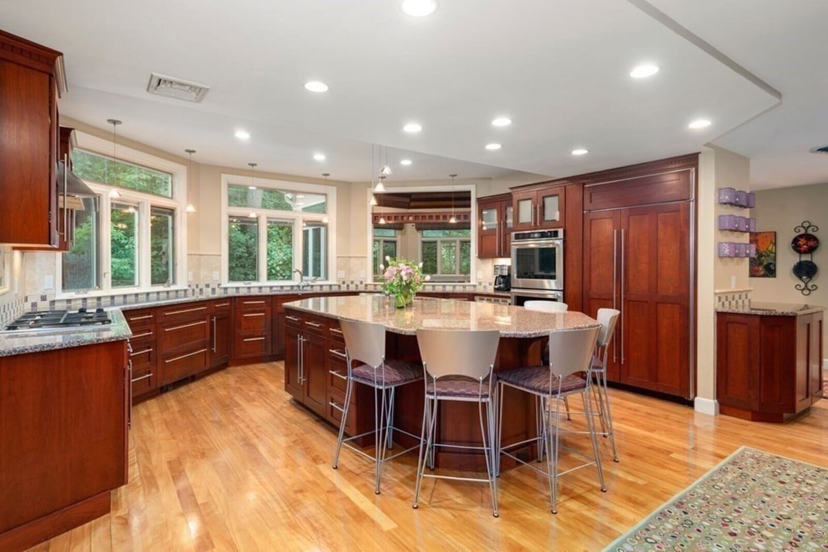 Updated kitchen space with recessed lighting, designed by Thomas Buckborough & Associates in Acton, MA